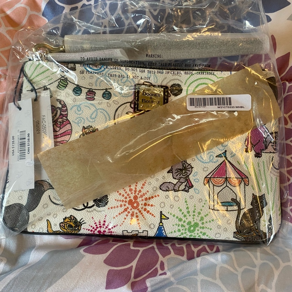 Brand new in bag, Disney Dooney Cats wristlet.